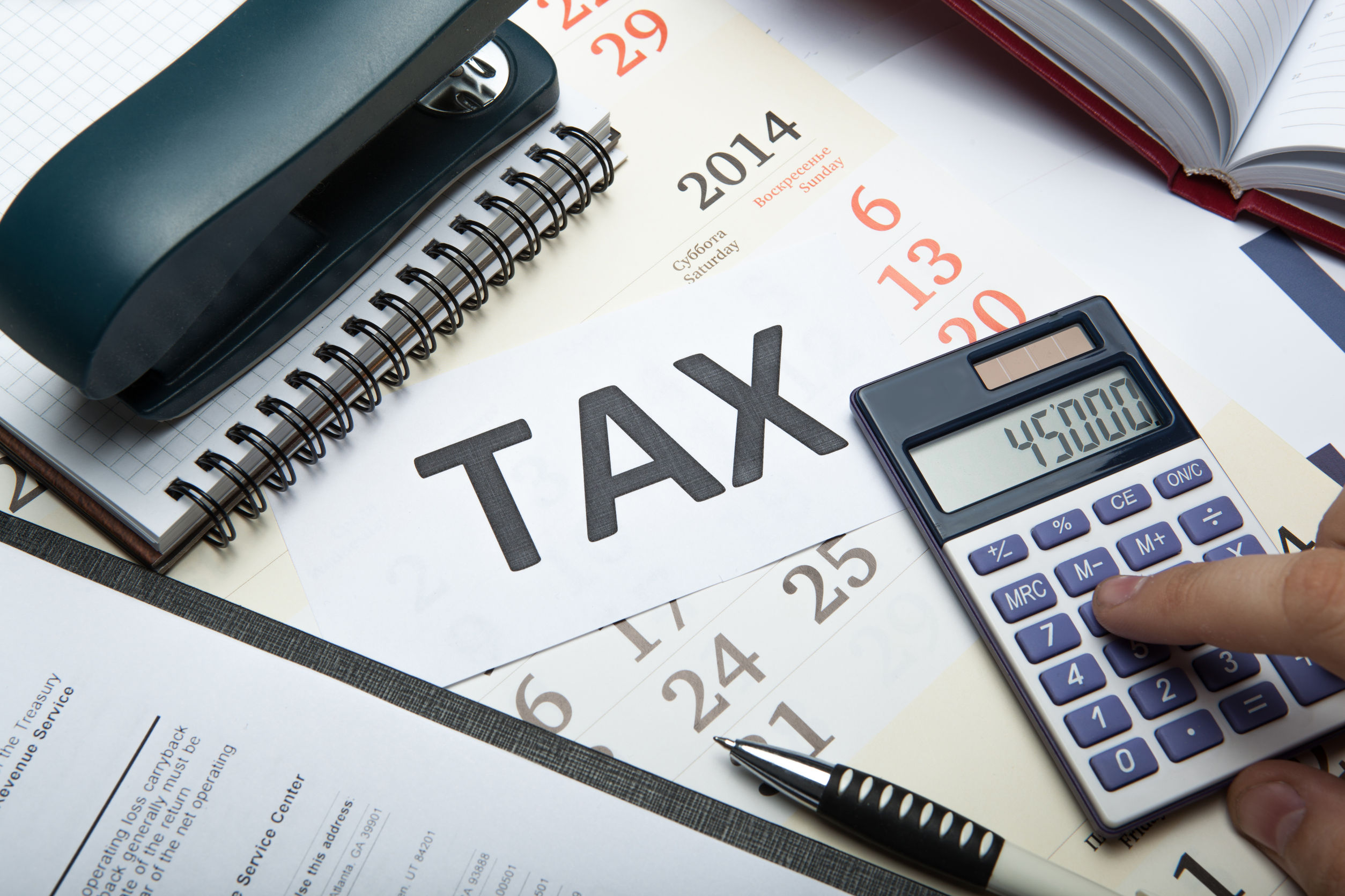Accountant reconciling ledgers and receipts